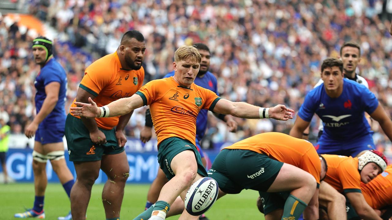 Tate McDermott of Australia kicks the ball upfield. (Photo by David Rogers/Getty Images)