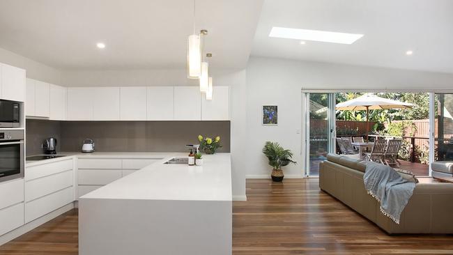 Open-plan living spaces spill to an outdoor entertainment deck.