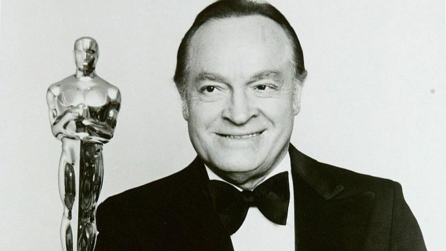  Actor comedian Bob Hope holding Academy Award (Oscar) statuette.