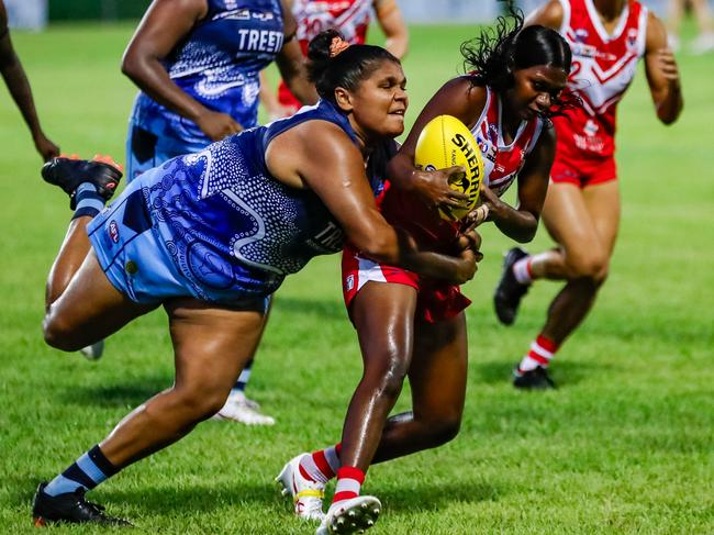 Darwin Buffettes' star Molly Althouse tackles Waratah's Aggie Singh Lippo during the 2023-24 NTFL season. Picture: Celina Whan / AFLNT Media