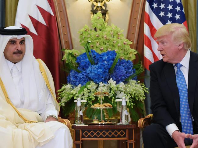 US President Donald Trump speaks with Qatar's Emir Sheikh Tamim Bin Hamad Al-Thani, during a bilateral meeting at a hotel in the Saudi capital Riyadh.