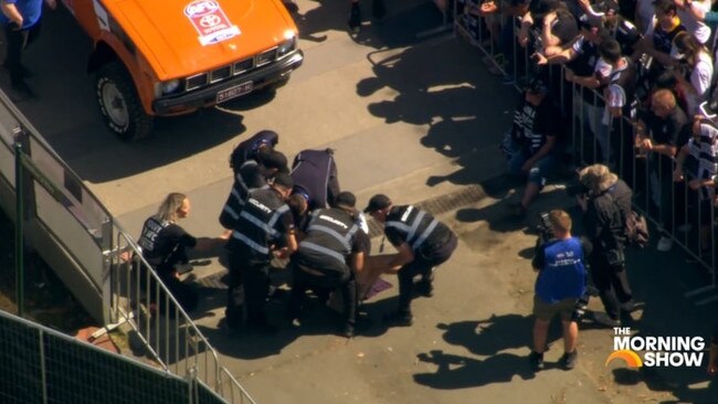 The Extinction Rebellion protestors wore T-shirts saying "can't play footy in 50 degrees". Picture: 7News