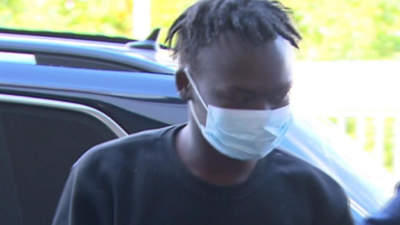 Mathiang Malok being taken through Melbourne Airport during his extradition back to SA in 2022. Picture: 7NEWS