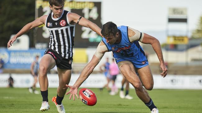 Sturt’s Patrick Wilson (right) wins the ball under pressure from Port Adelaide’s Taj Schofield. Picture: Matt Loxton.