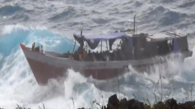 An asylum seeker boat crashes at Christmas Island in 2010.