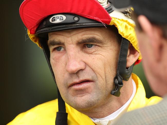 A swollen Dwayne Dunn returns to the mounting yard after taking out the opening race at Sandown Hillside.