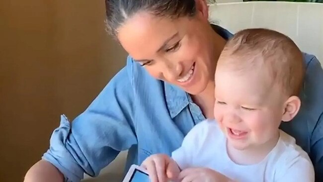 Meghan, Duchess of Sussex reads to son Archie in this photograph taken in May last year. Picture: AFP