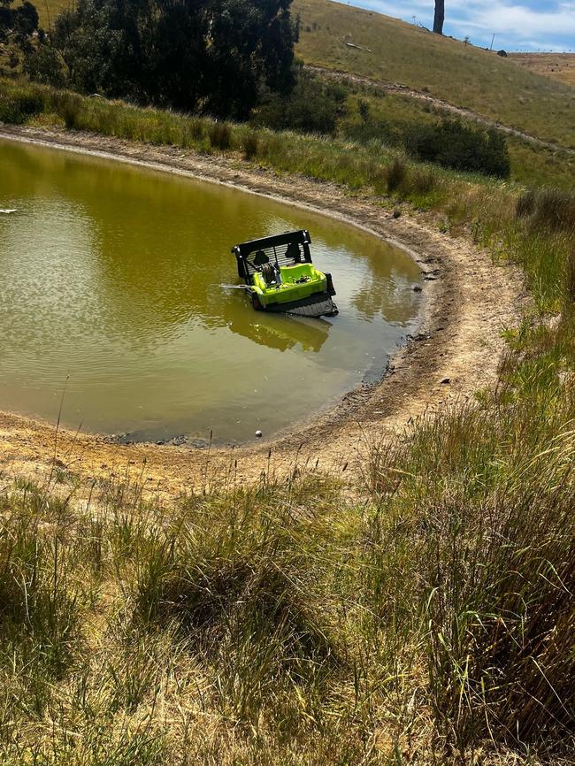 Scott Pape's $25,000 John Deere Gator Utility Vehicle submerged in his dam.