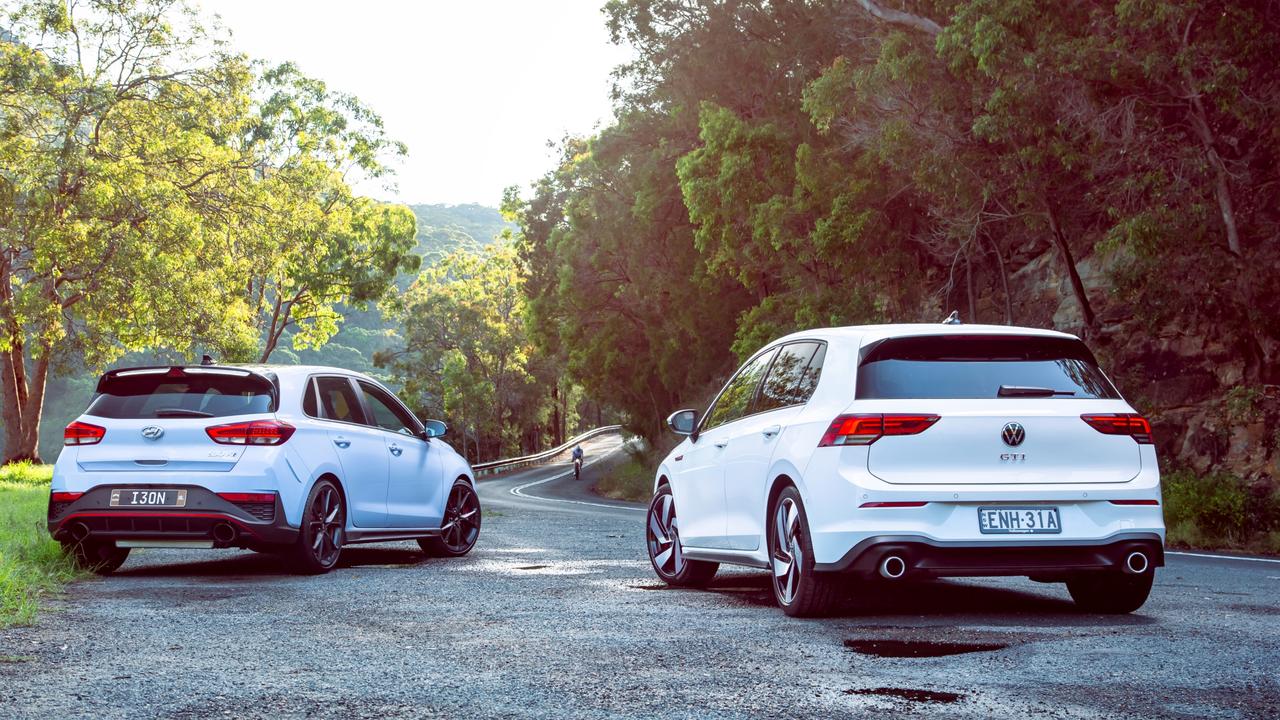 Hyundai i30 N Premium (left) and Volkswagen Golf GTI are two of the best affordable performance cars on sale. Picture: Thomas Wielecki