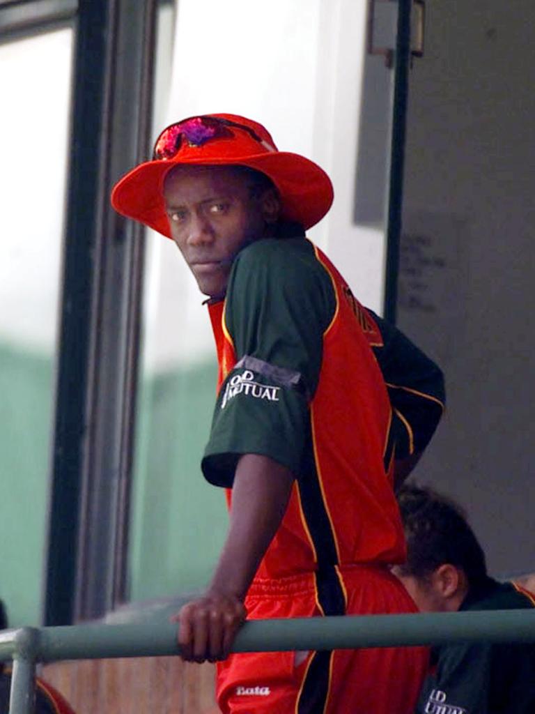 Henry Olonga, wears a black arm band while watching his side batting in their Cricket World Cup match against Namibia in Harare. (AP Photo/str)