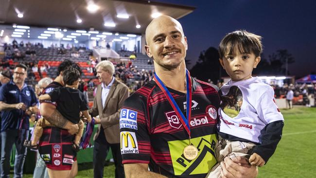 Valleys player Curtly Hammond with son Kalyn Hammond after winning the reserve grade TRL grand final. Hammond has signed with the Highfields Eagles for 2025. Picture: Kevin Farmer