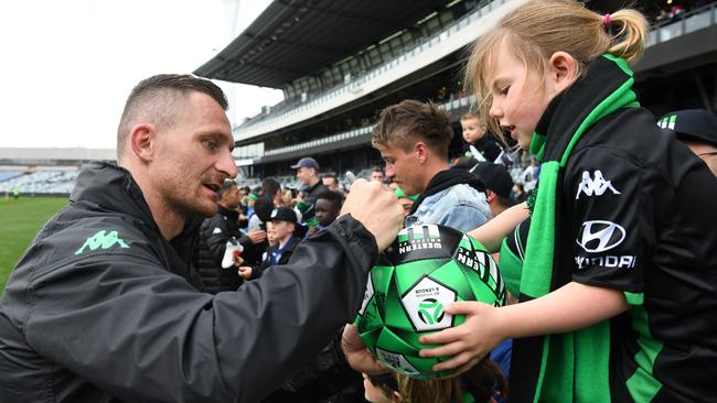 Western United striker Besart Berisha signs an autograph for a fan of the new A-League club. Picture: AAP
