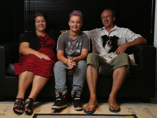 Kai Bogert (centre) with his parents Yolanda Bogert and Guy Kershaw, with their dog Pebbles. Photo: Marc Robertson.