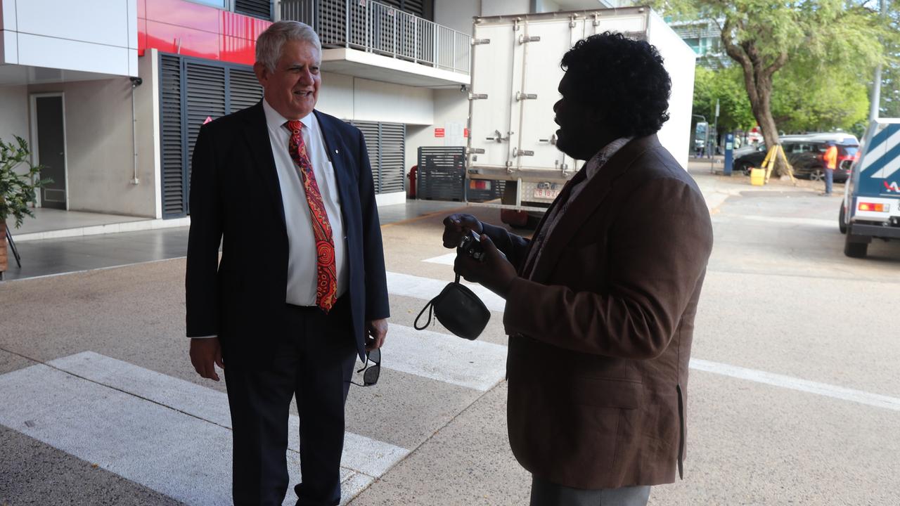 Mirarr man Corben Mudjandi speaking with former federal Indigenous Affairs minister Ken Wyatt outside the Energy Resources of Australia Annual General Meeting of shareholders. Picture: Zizi Averill