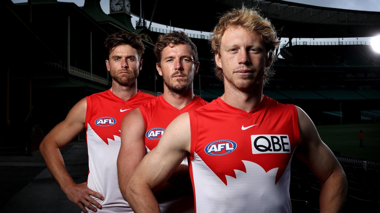 Callum Mills (front, with Dane Rampe and Luke Parker) is making a huge impression in his first season as the Swans’ co-captain. Picture: Phil Hillyard