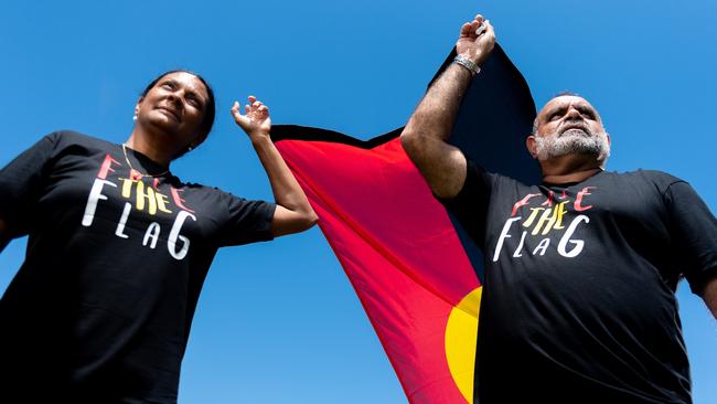 Nova Peris and Michael Long stand with the Aboriginal Flag at Gardens Oval, Darwin ahead of the AFL's Dreamtime Round. Picture: Che Chorley