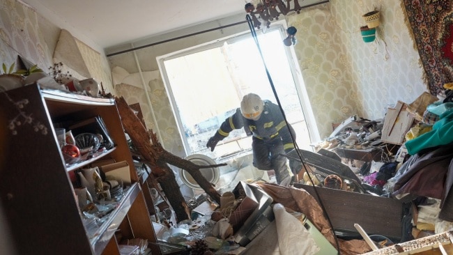 Inside one of the damaged apartments as firefighters rescue residents from the building. Picture: Wolfgang Schwan/Anadolu Agency via Getty Images