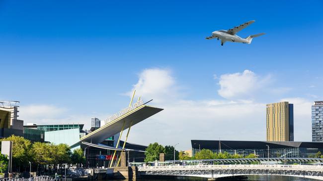 Render of Electra Aero vehicle flying over the Yarra River.