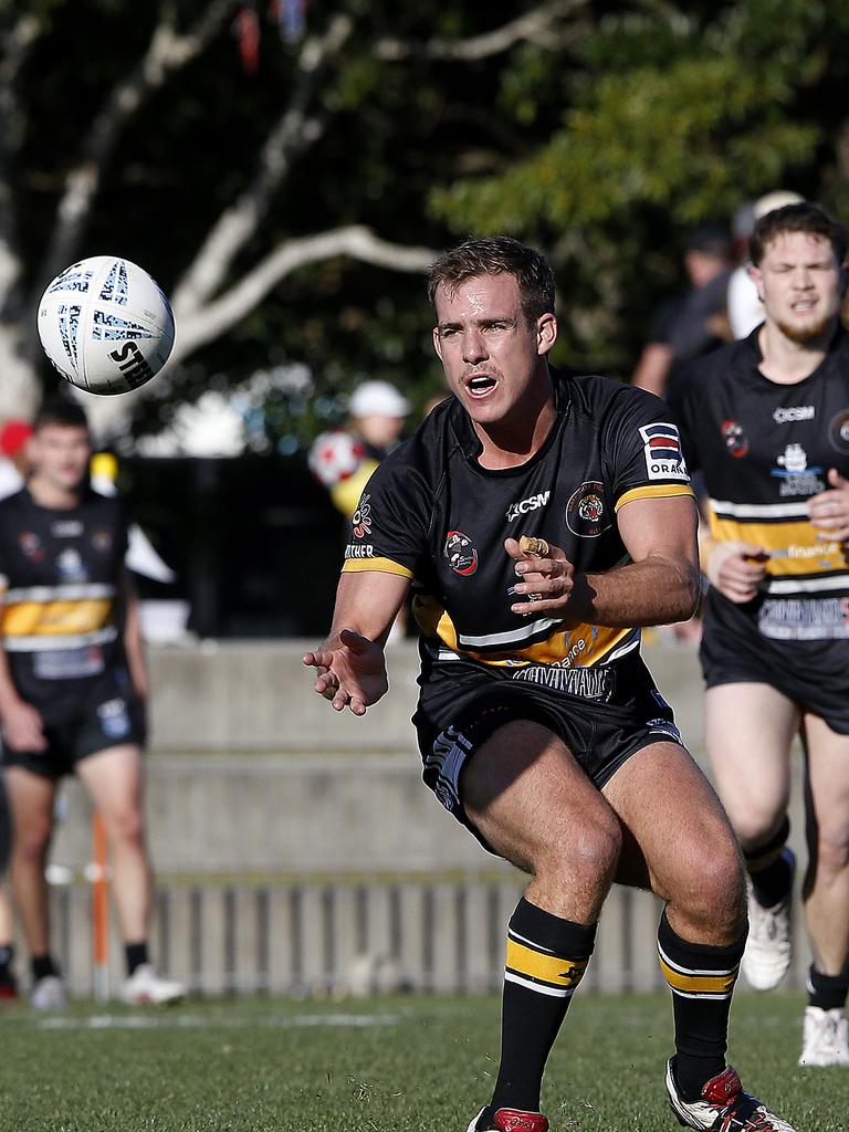 Matraville's Kurtis Preece gets the ball away. Picture: John Appleyard