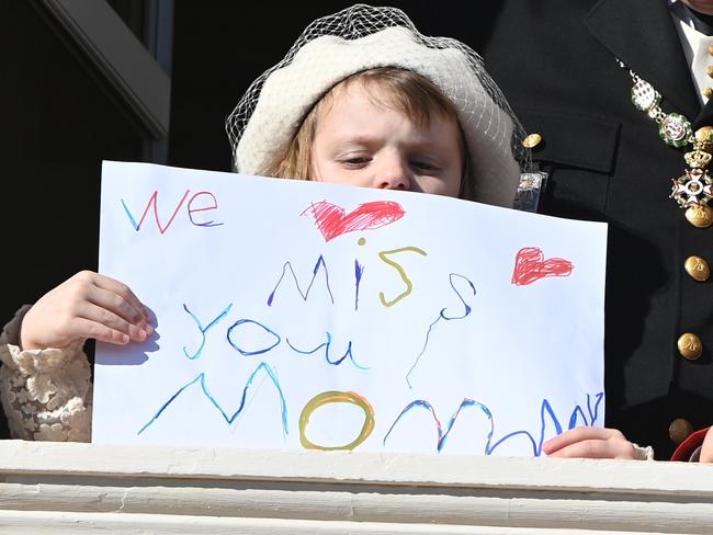 Princess Gabriella and her handmade sign to her mum. Picture: Pascal Le Segretain/Getty Images