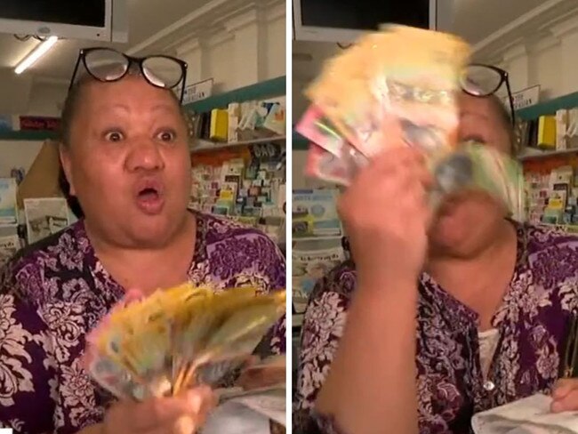 Lotto winner shows off huge cash prize