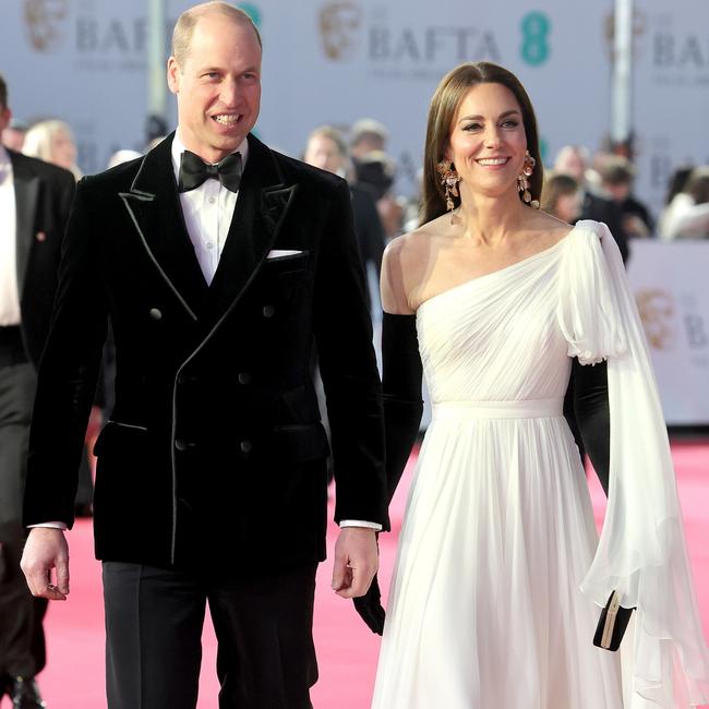 Jaws dropped when Princess Catherine, with Prince William, Prince of Wales, attended the BAFTA Film Awards in a white Jenny Packham dress and shoulder-length black satin opera gloves she had worn before. Picture: Chris Jackson/Getty Images