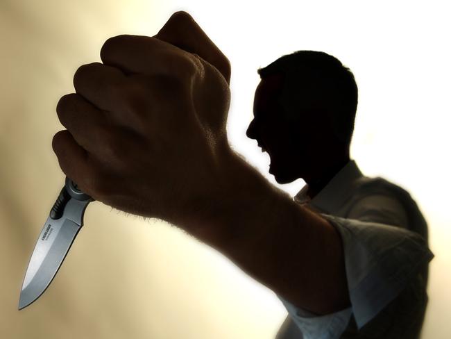 Generic image of a knife-wielding lunatic. Stabbing. Stabbed. Crime. Knife crime. Knives. Man.