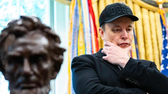 Elon Musk looks on during a news conference with US President Donald Trump in the Oval Office of the White House in Washington, DC, on May 30, 2025. Musk, who stormed into US politics as President Trump's chainsaw-brandishing sidekick, announced on May 28 that he is leaving his role in US government, intended to reduce federal spending, shortly after his first major break with the President over Trump's signature spending bill. (Photo by Allison ROBBERT / AFP)