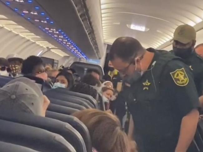 The passenger filmed officers boardimg the plane to arrest the woman. Picture: Alexa Majdalawi/TikTok