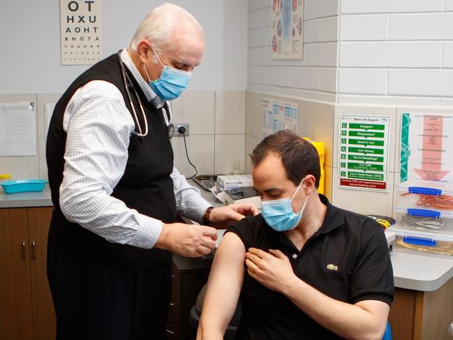 Vincent Tarzia, Minister for Police, Emergency Services and Correctional Services of South Australia getting the covid jab from Dr Mario Giordano at the Giordano Family Medical Practice on July 2, 2021. Picture Matt Turner.