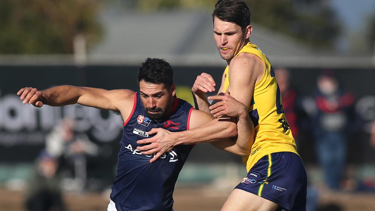 Norwood’s Paul Puopolo and Eagle’s Sam Rowland. Picture Dean Martin