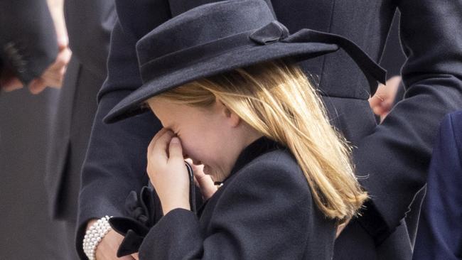 Princess Charlotte is comforted by her mother as she cries. Picture: Getty Images