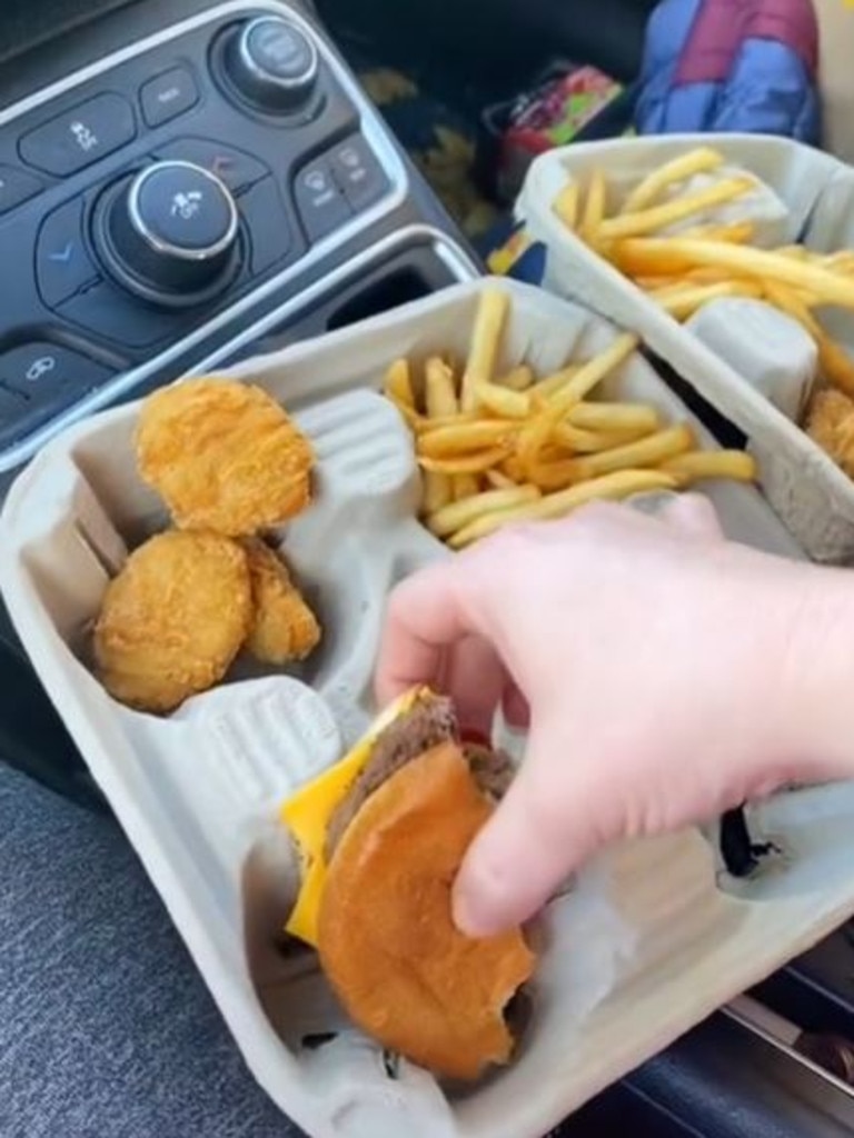 She uses a cup holder as a food tray. Credit: Tiktok