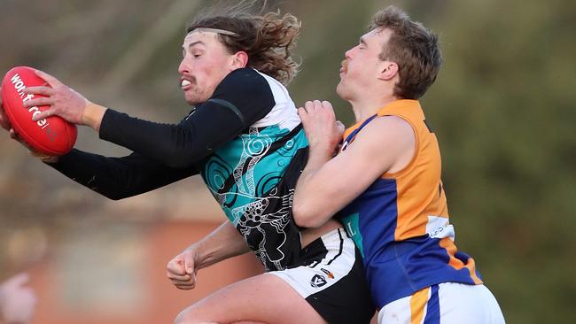 Maryborough’s Kya Lanfranchi marks the ball under pressure from Golden Square’s Jayden Burke. Picture: Yuri Kouzmin