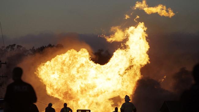 A massive fire roars through a mostly residential neighbourhood in San Bruno, California. Picture: AP