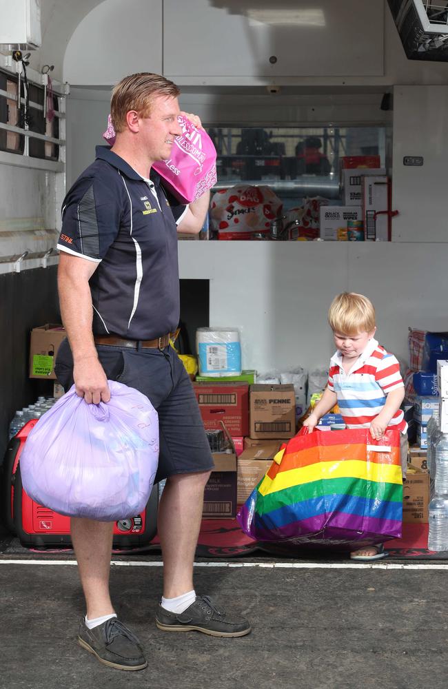 James Ross-Munro and son Fraser 2 are madly collecting essentials for a family in Coraki, NSW, who are in desperate need of assistance. Picture Glenn Hampson