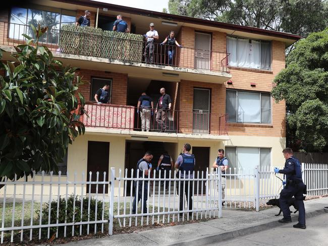 Police raid the Richmond public housing block. Picture: Alex Coppel