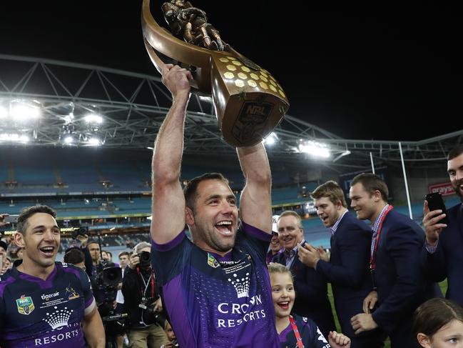 Smith hoists the premiership trophy after Melbourne won the 2017 grand final. Picture. Brett Costello