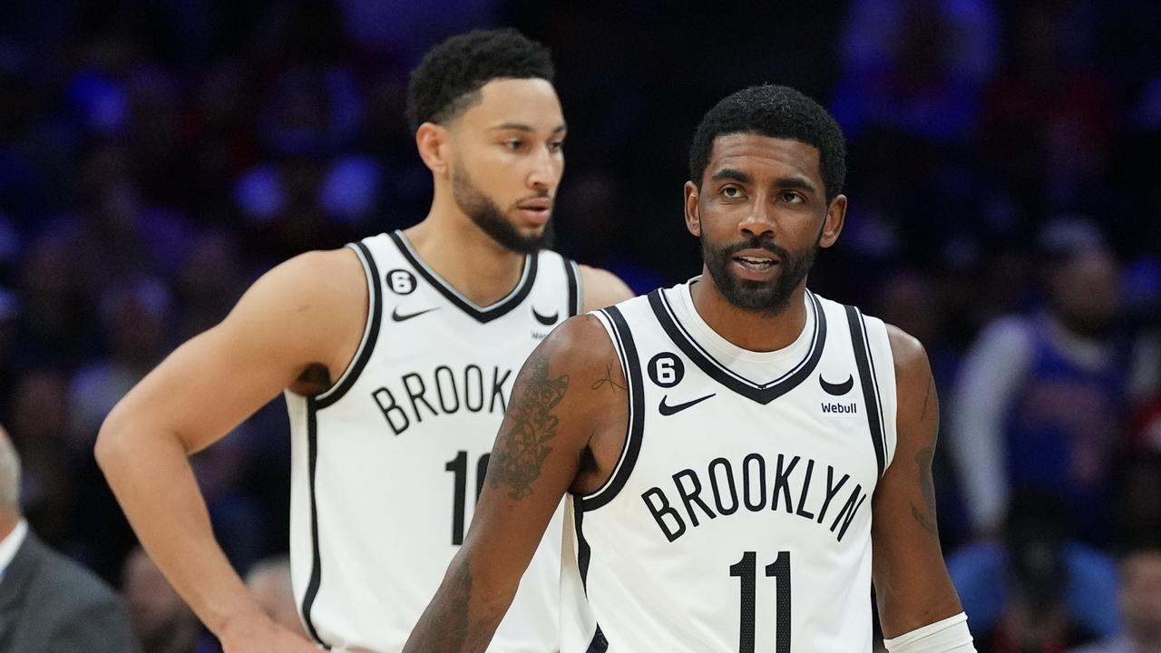 PHILADELPHIA, PA - NOVEMBER 22: Ben Simmons #10 and Kyrie Irving #11 of the Brooklyn Nets look on against the Philadelphia 76ers at the Wells Fargo Center on November 22, 2022 in Philadelphia, Pennsylvania. NOTE TO USER: User expressly acknowledges and agrees that, by downloading and or using this photograph, User is consenting to the terms and conditions of the Getty Images License Agreement. (Photo by Mitchell Leff/Getty Images)