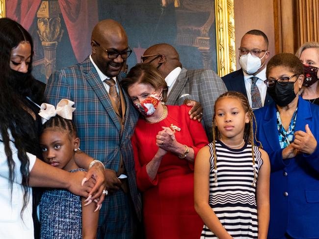 Philonise Floyd, the brother of George Floyd, puts his arm around House Speaker Nancy Pelosi, D-CA, as he and other members of the Floyd family meet with leaders in the Rayburn Room of the US Capitol in Washington, DC. Picture: AFP