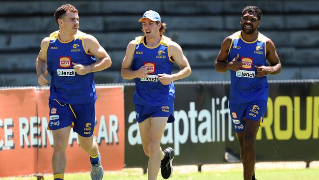 Mitchell O'Neill of the Eagles (centre) jogs laps with Luke Shuey and Liam Ryan during a West Coast Eagles pre-season AFL training session in Perth. Picture: Paul Kane/Getty Images