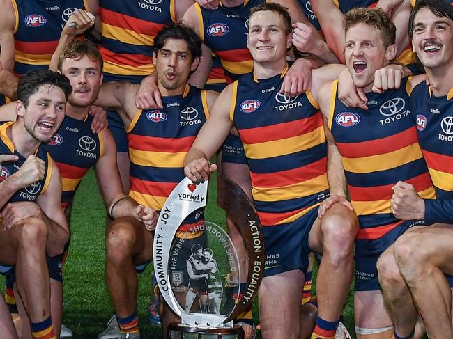 ADELAIDE, AUSTRALIA - JULY 29: The Crows pose with the Variety Showdown Shield after winning the round 20 AFL match between Adelaide Crows and Port Adelaide Power at Adelaide Oval, on July 29, 2023, in Adelaide, Australia. (Photo by Mark Brake/Getty Images)