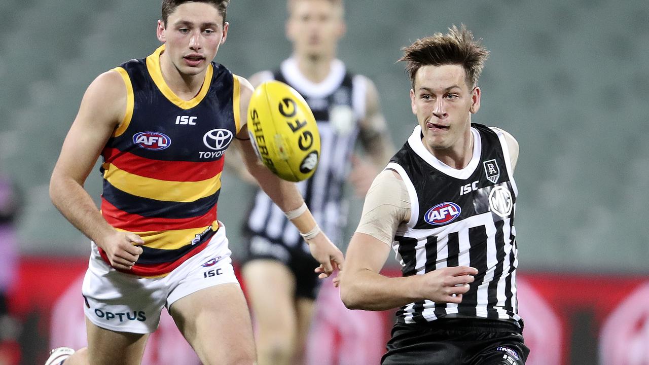 AFL – SHOWDOWN 48 – Port Adelaide v Adelaide Crows at the Adelaide Oval. Zak Butters gets his kick away from Chayce Jones. Picture SARAH REED