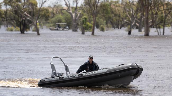 Police searching the water after a body was found in the area around Ross Lagoon at Taylorville on Sunday afternoon. Picture: The Advertiser/ Morgan Sette