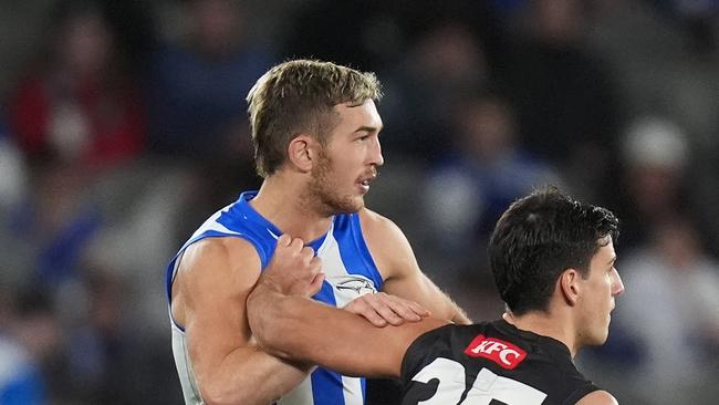 MELBOURNE, AUSTRALIA - JUNE 16: Will Phillips of the Kangaroos and Nick Daicos of the Magpies compete during the round 14 AFL match between North Melbourne Kangaroos and Collingwood Magpies at Marvel Stadium, on June 16, 2024, in Melbourne, Australia. (Photo by Daniel Pockett/Getty Images)