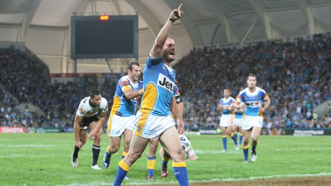 Chris Walker celebrates the Titans' second try during the Qualifying Final between the Gold Coast Titans and Brisbane Broncos at Skilled Park Stadium on September 12, 2009. The crowd of 27, 227 remains a venue attendance record. Photo: Colin Whelan AAP