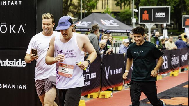 Team Never DNF cross the line at the Ironman 70.3 Tasmania in Hobart on Sunday 4th February 2024. Picture: Linda Higginson