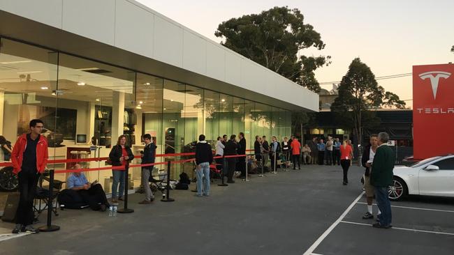 Andreas Stephens and other Tesla buyers outside the Tesla shop to place their order for a Tesla Model3