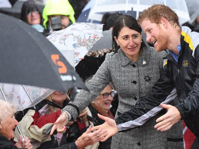 Prince Harry recognised Daphne today during his walkabout in Circular Quay in the rain today. Picture: Dean Lewins