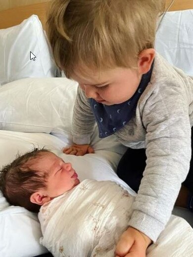 Channel 7 Gold Coast news reader Amanda Abate and her husband Brent Beauchamp welcome their second child, Pia Rose, on Thursday. Amanda wrote on her Instagram account that son Bobby was besotted with his baby sister. Picture: @amandaabate7/Instagram